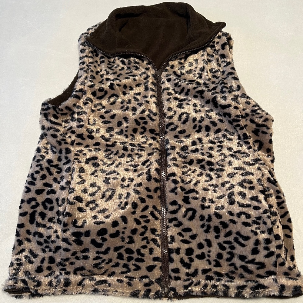 Reversible vest leopard print on one side brown on the other.